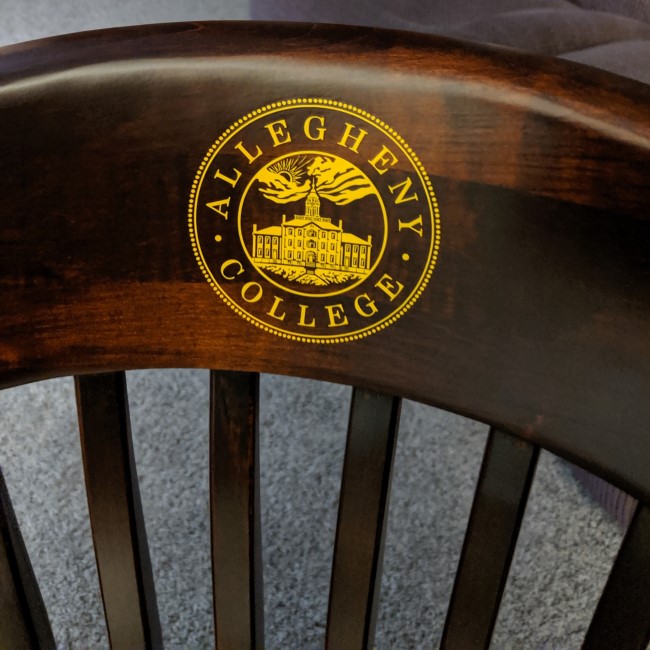 Allegheny College Chair in brown finish with gold Allegheny College seal; college chairs