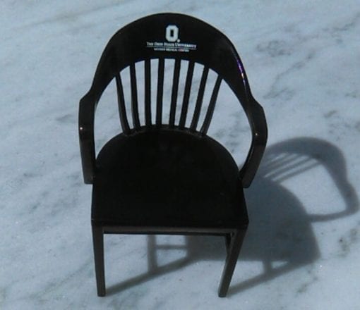 front view of black college chair of Ohio State on white marble