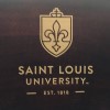 Gold logo of Saint Louis University on brown chair