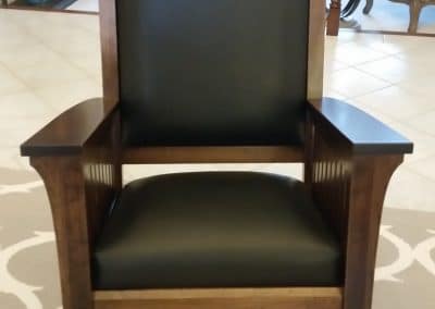 Brown Mission Rocking Chair with black leather and blue logo for college chairs