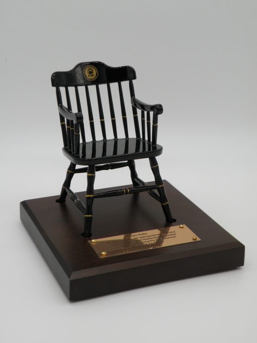 Black miniature captain's chair on brown maple base with brass nameplate - college chairs of Lajolla Country Day School