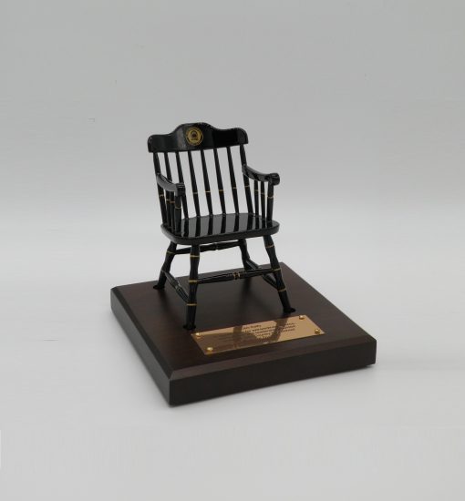 black miniature college chair on brown maple base with brass plate