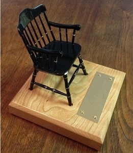 black Miniature Chair on light cherry base with brass nameplate for college chairs facing right