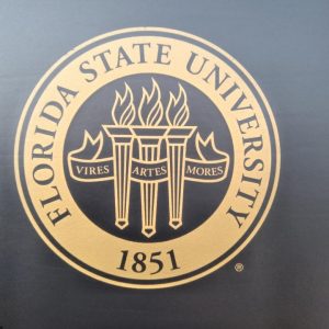 Florida State Chair in black with gold Seal , an example of college logos