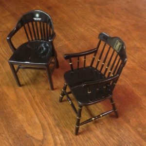 TWO BLACK MINIATURE CHAIRS OF DIFFERENT STYLES