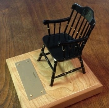 miniature college chair with light cherry base and nameplate.