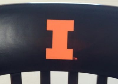 Black University of Illinois chair with orange 'I' logo